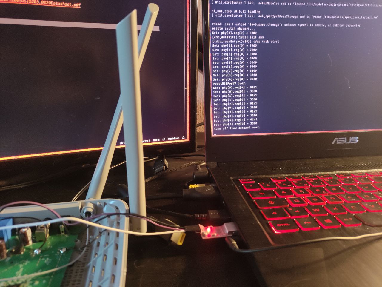 A second bench photo showing the serial boot log with kernel module loads, "tddp task start", and the switch PHY register writes