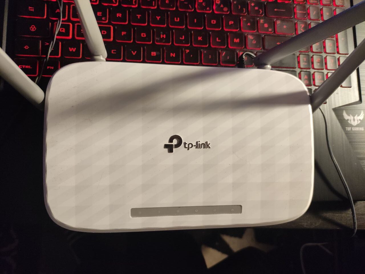 A closed TP-Link Archer AC1200 router, still assembled, before teardown